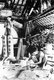 Vietnam: A blacksmith with his assistant using Chinese-style bellows in Hoi An (1950)